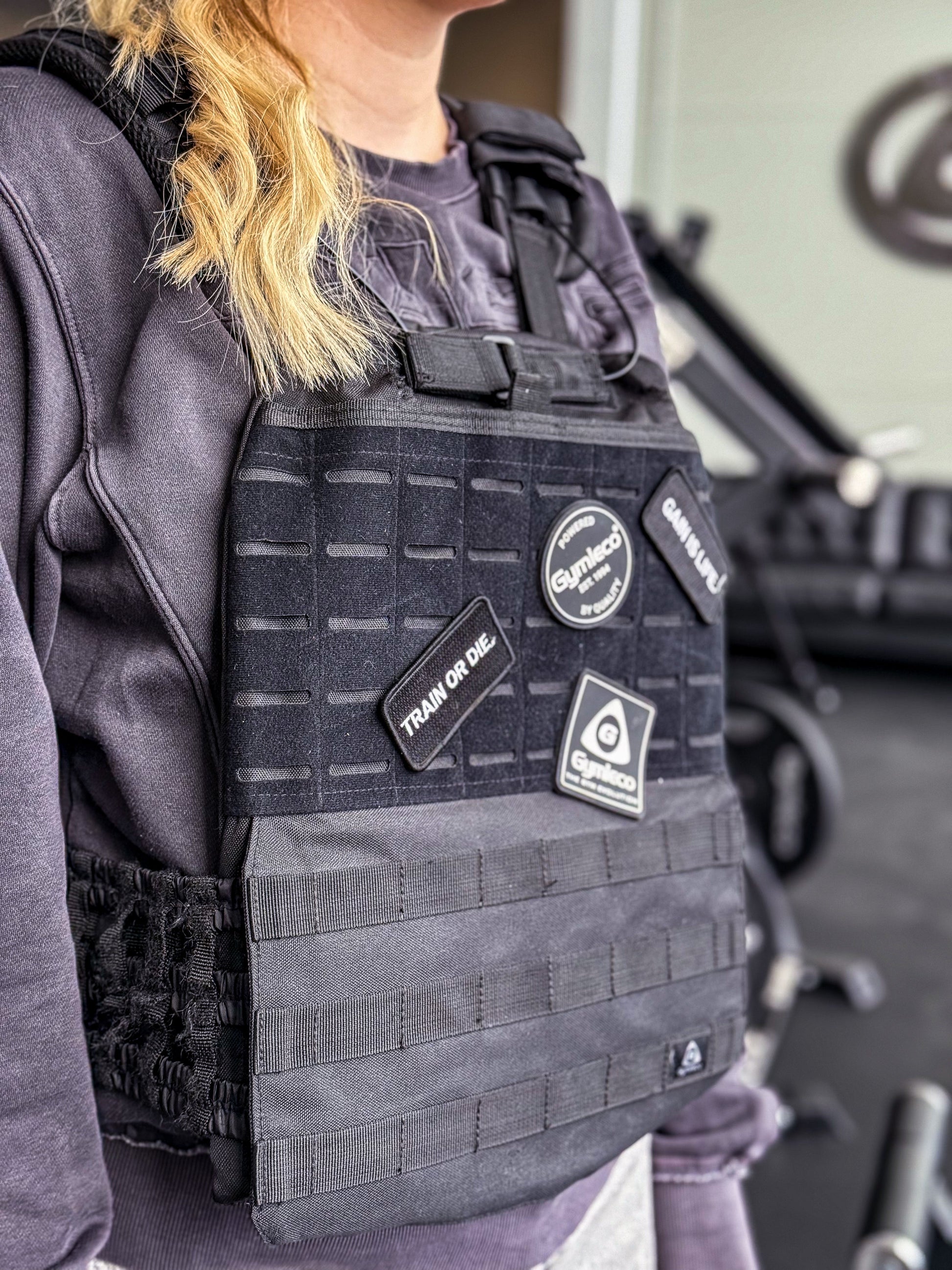 Weight vest with patches on.