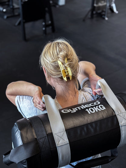 Gymleco Sandbag being used by a woman, picture taken from above